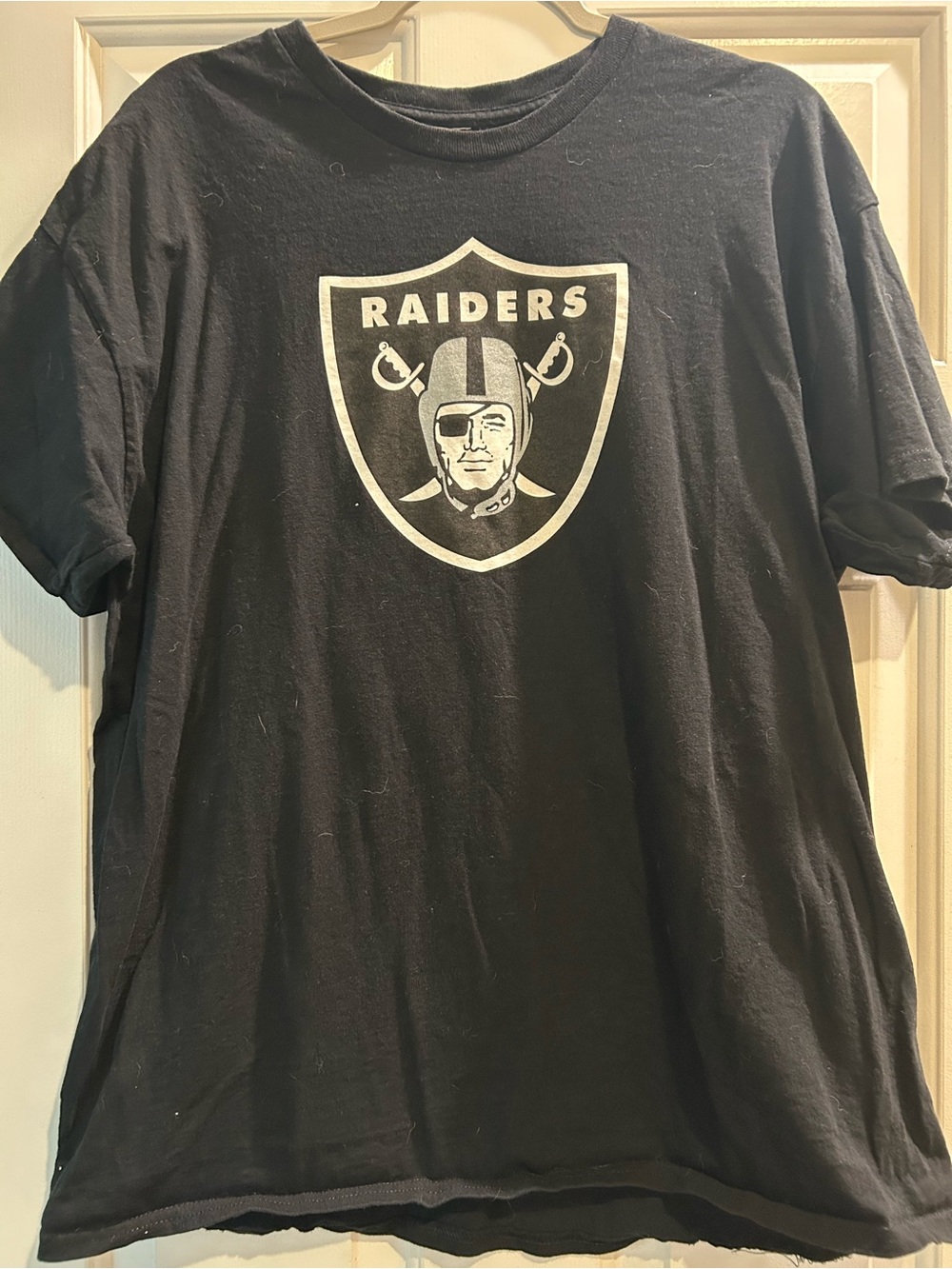 Raiders Black Tee with Silver Raiders Shield Graphic